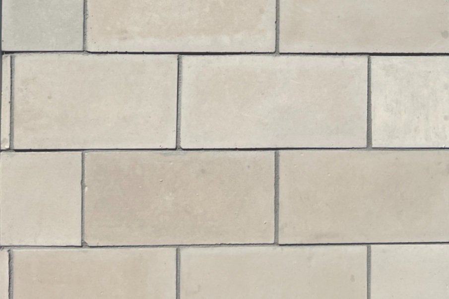 warm toned large format tile replicating limestone