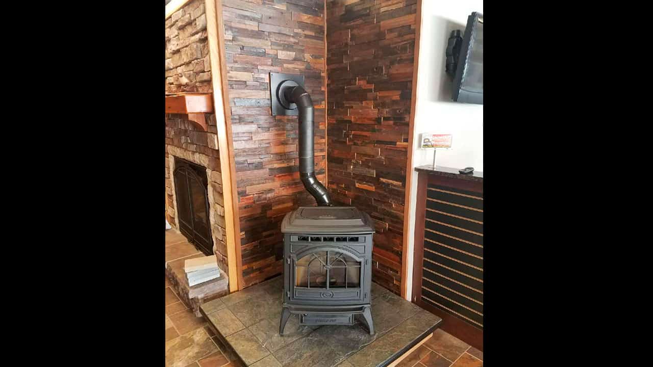 Reclaimed Wood Accent wall and Wood Burning Stove - Realstone Systems