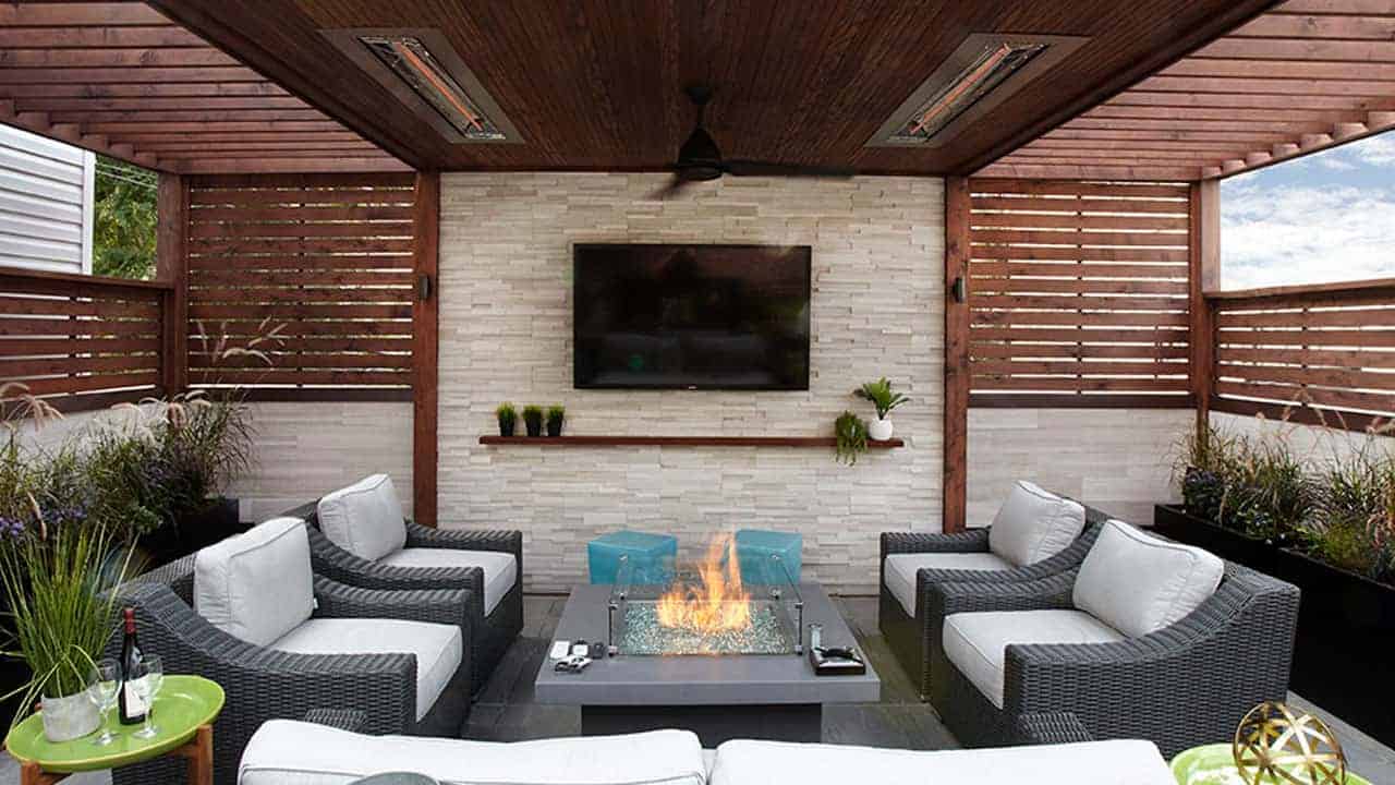 Television mounted above a contemporary stone veneer fireplace