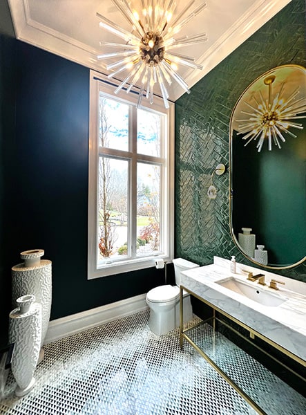 jade green tile in a modern luxury powder room with mosaic tile floor and starburst chandelier