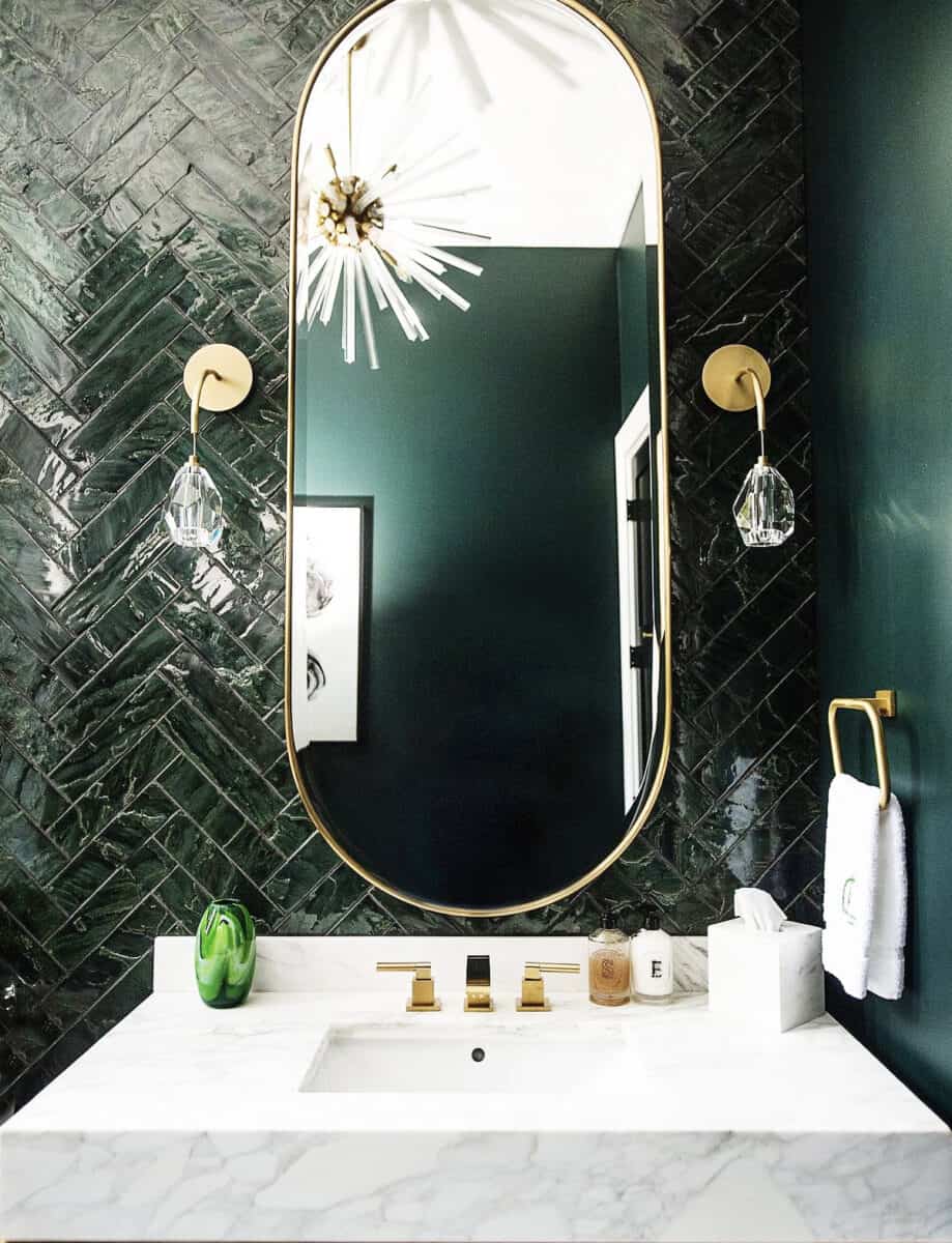 glamorous jade green powder room with starburst chandelier, crystal pendant lights and gold fixtures