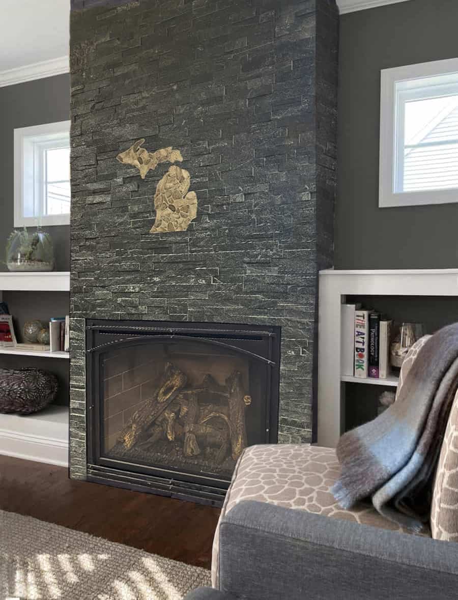 natural stone veneer fireplace with Petoskey stones and map of Michigan