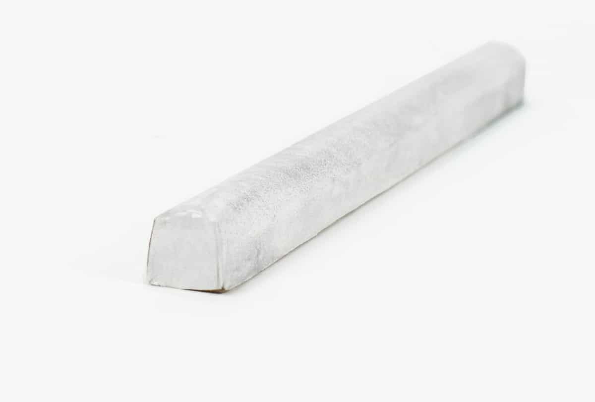 Tempered Bullnose Trim Nickel Leather wrapped bullnose trim with subtle silver accents that pairs with Tempered leather natural stone tiles