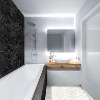 Black MArble Hexagon tile in a modern luxure bathroom with white marble penny round tile floor and large soaking tub in a black and white design style