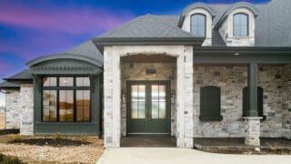 warm toned faux stone on home exterior entry way and porch