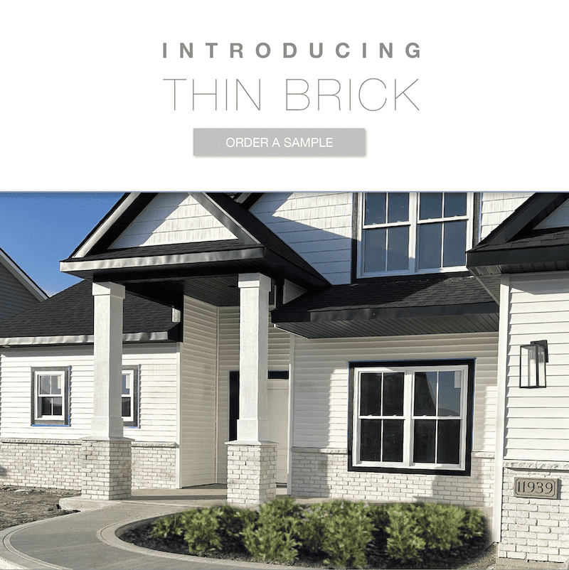 White Thin Brick on image of colonial style home with white siding home