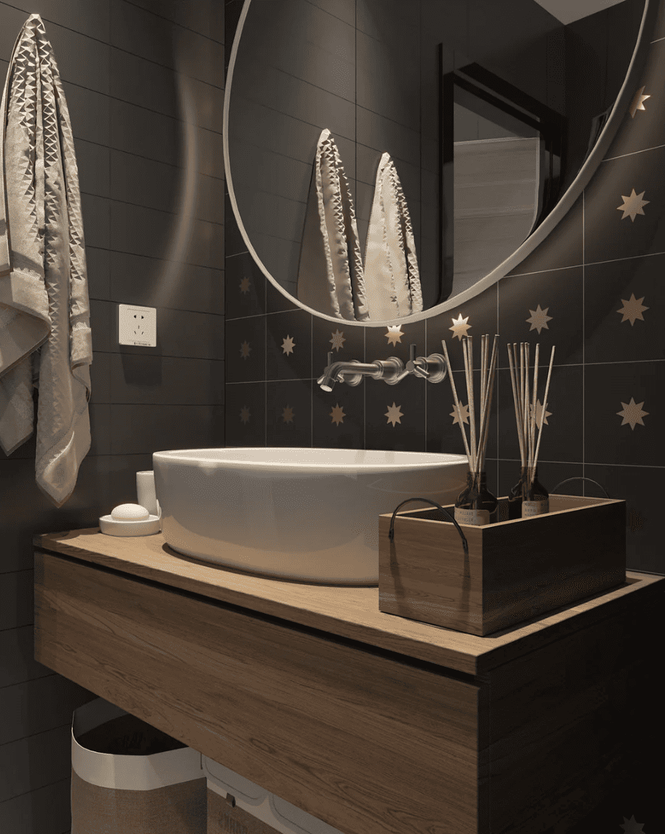 Bathroom backsplash with black cement tile with brass star inlay