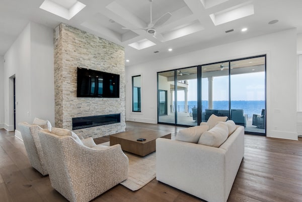 Realstone natural stone veneer Silver Alabaster Panels fireplace with seaside view