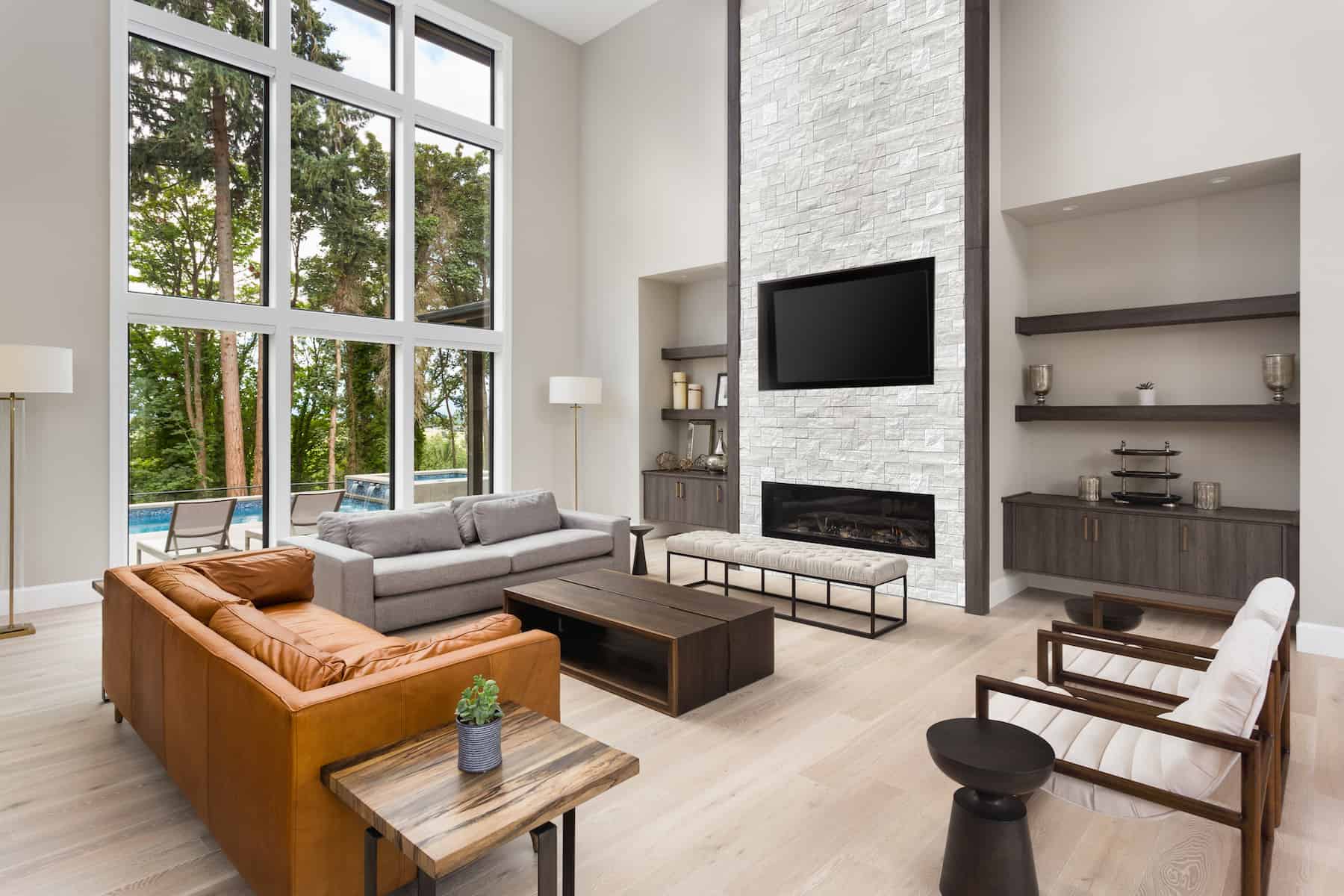 Stone veneer fireplace with built-in storage cabinets with White Birch Honed natural stone veneer