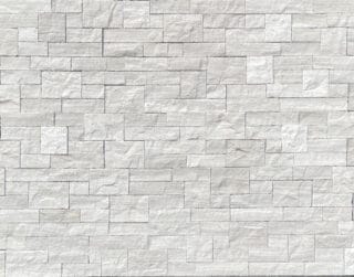 white birch estate stone swatch is a pale gray natural stone veneer limestone with the coloring of birch trees