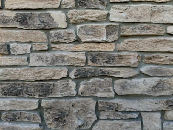 earth tone colored faux stone wall