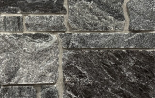 A darker grayed blue stone that has sawn edges for better fitting