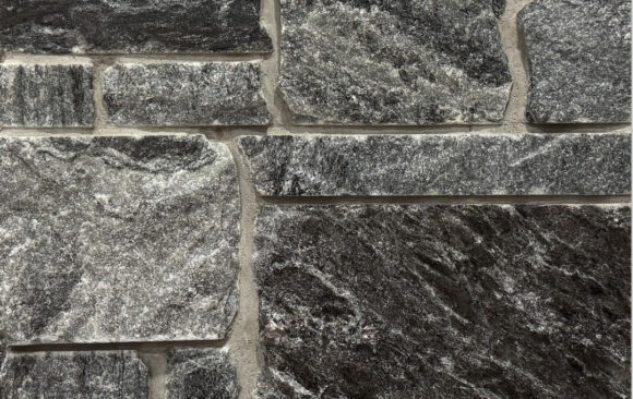 A darker grayed blue stone that has sawn edges for better fitting