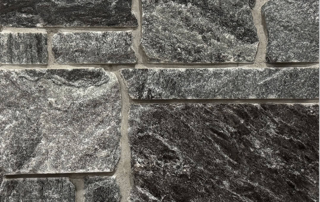 A darker grayed blue stone that has sawn edges for better fitting