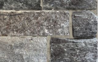 A darker grayed blue stone that has sawn edges in squares for better fitting