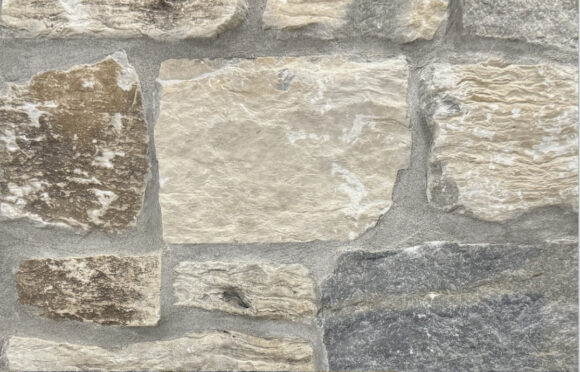 Tumbled finish loose limestone samples in shades of light grey, gold and blue-grey undertones