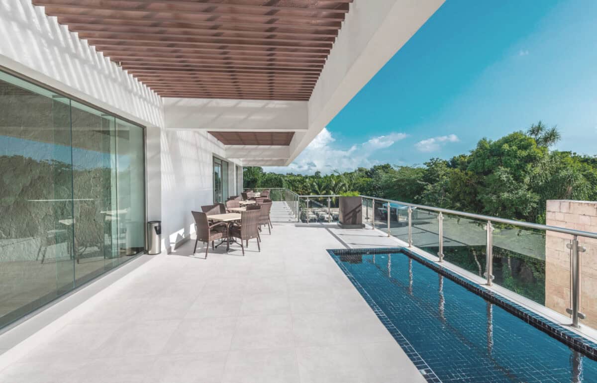 Bright white outdoor porcelain pavers laid out for a pool and patio walkway