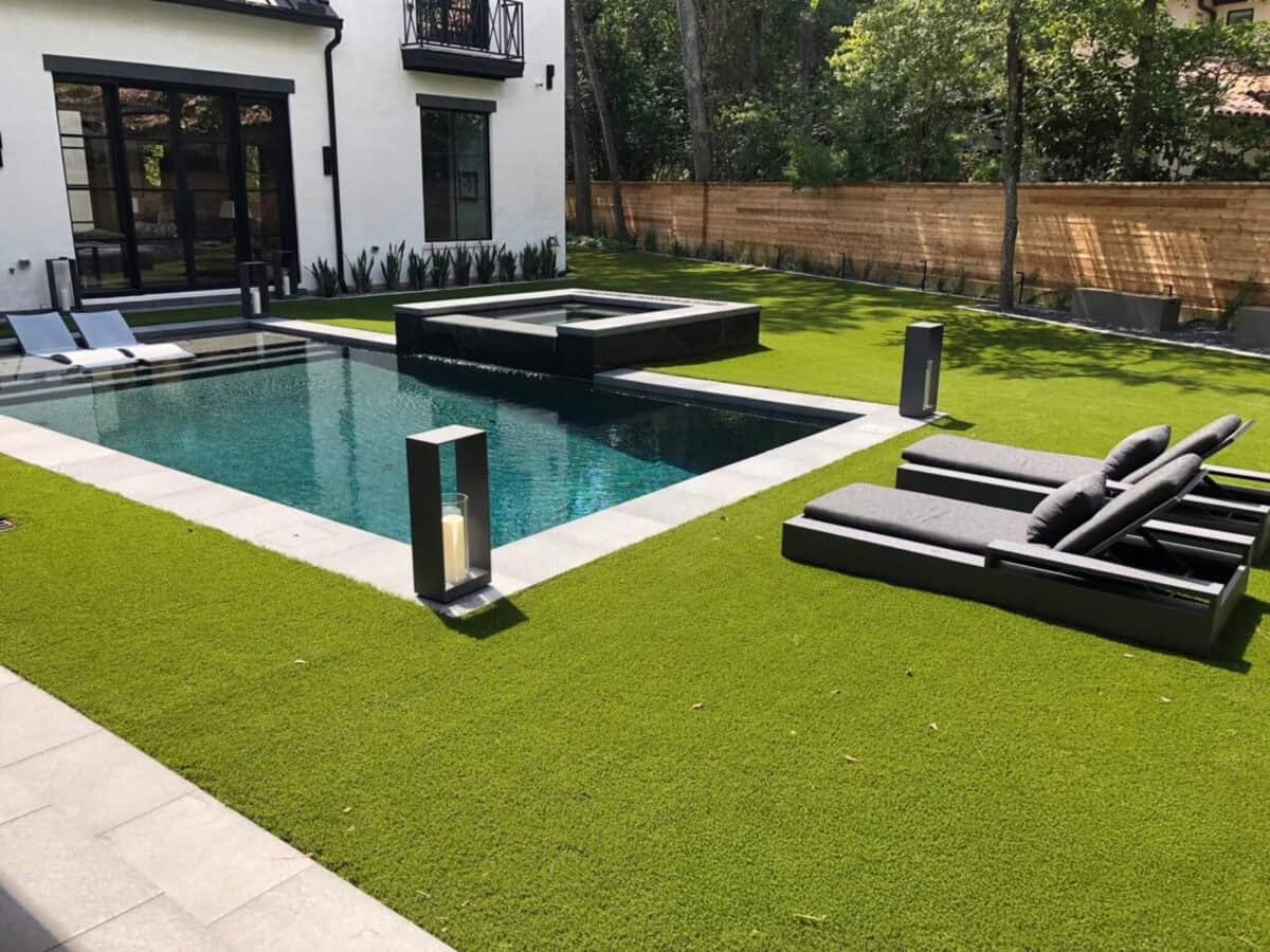 Dark, black outdoor porcelain pavers set up in an outdoor pool feature and walkway
