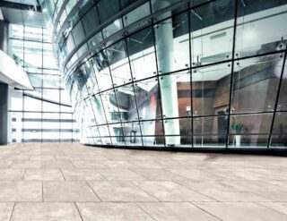 Light creme, antique finished white outdoor porcelain pavers used to finish an entryway