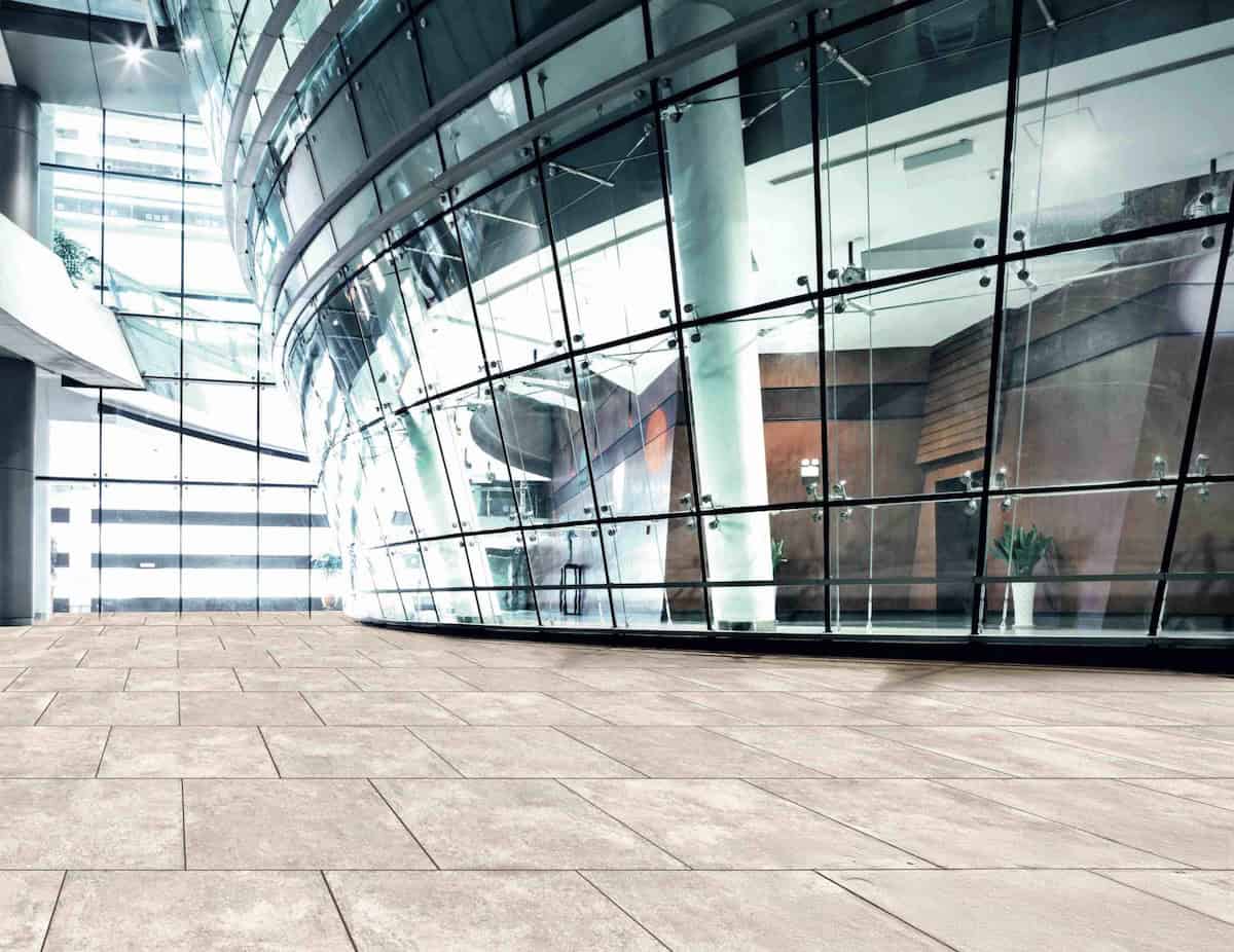 Light creme, antique finished white outdoor porcelain pavers used to finish an entryway