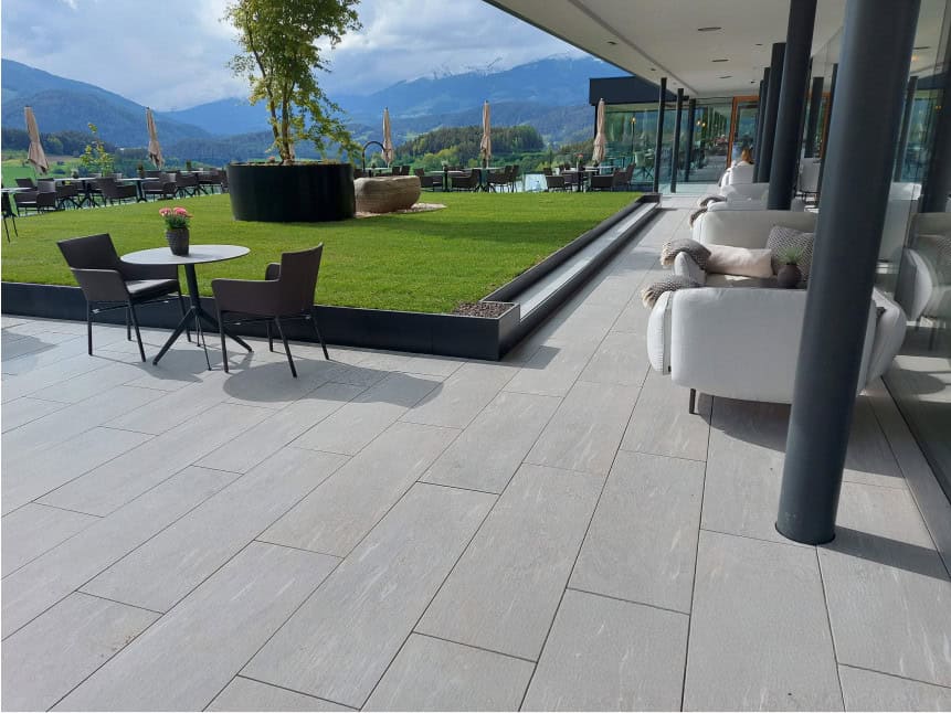 Light gray to beige colored outdoor porcelain pavers set up for an outdoor patio and backyard