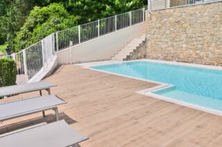 Light timber looking, pale wood outdoor porcelain pavers set up for a rooftop pool and walkway