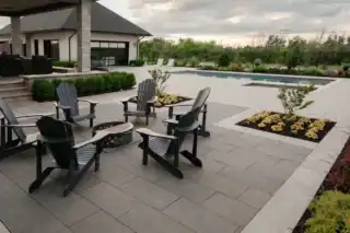 Black granite looking outdoor porcelain pavers used to finish an outdoor patio and adds a beautiful sparkle with the finish