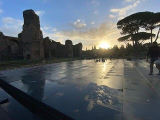 Dark black outdoor porcelain pavers that are designed to look more natural, are set up for an outdoor patio terrace, still in the design and implementation stages