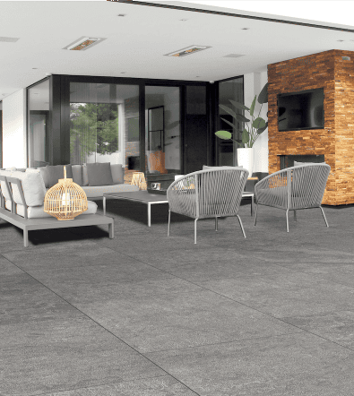 Light gray hued outdoor porcelain pavers that have undertones of blue, used to create a patio and outdoor area
