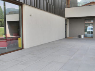 Light medium gray colored outdoor porcelain pavers that resemble clouds as they are very random and look beautiful in an outdoor patio setting