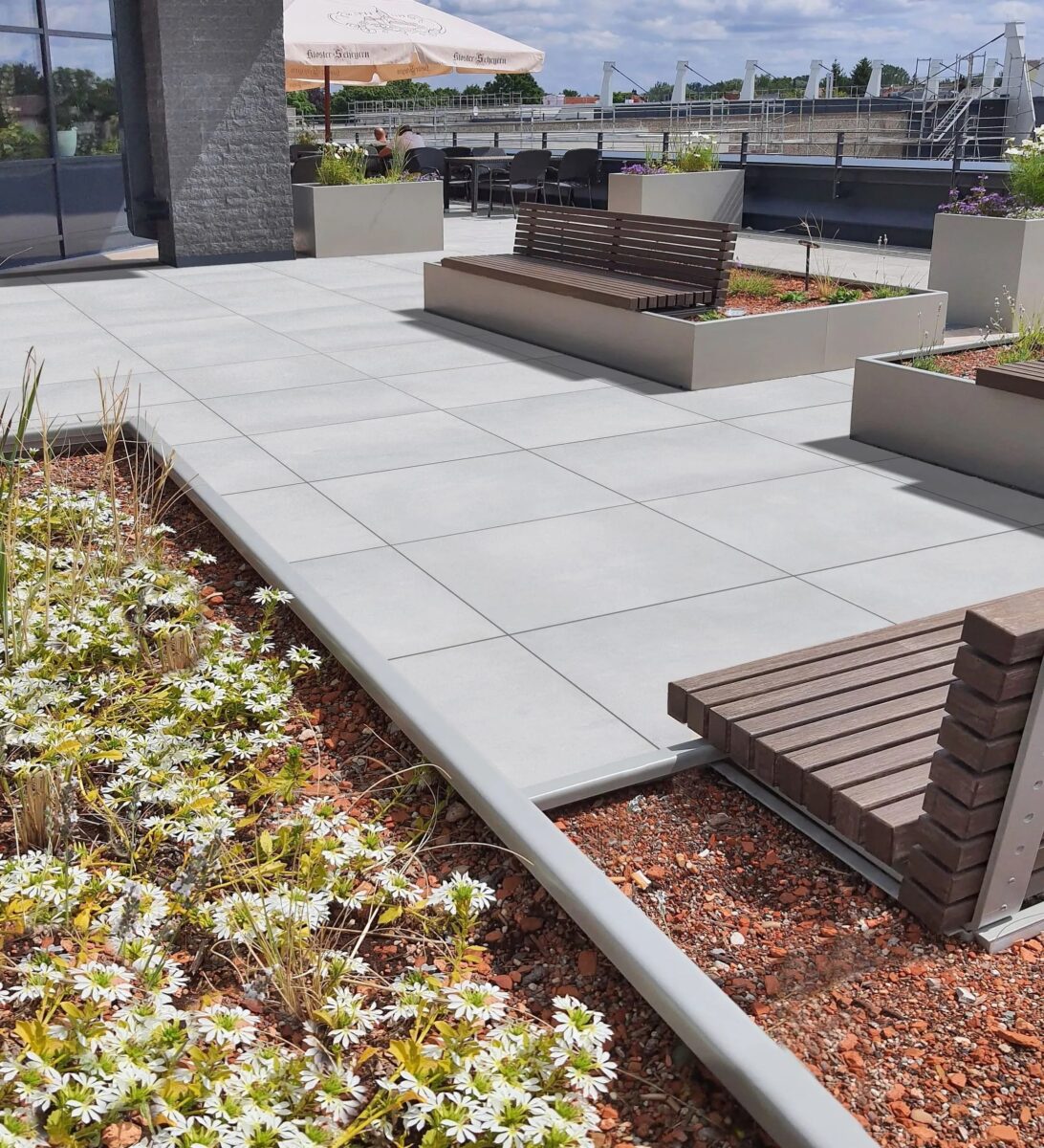 Light gray almost white outdoor porcelain pavers that are stain resistant and maintenance free and are perfectly used for an entryway