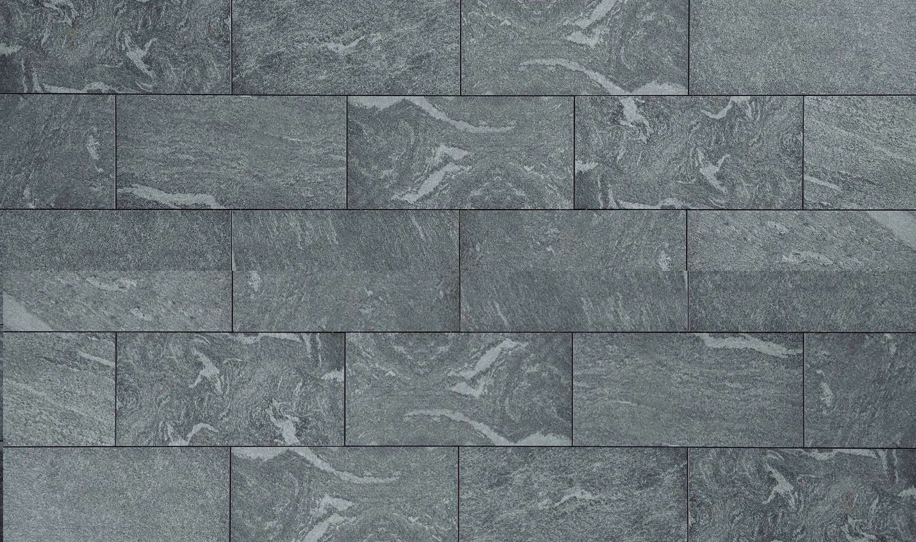 Heavily textured, gray to black outdoor porcelain pavers that have a premium look