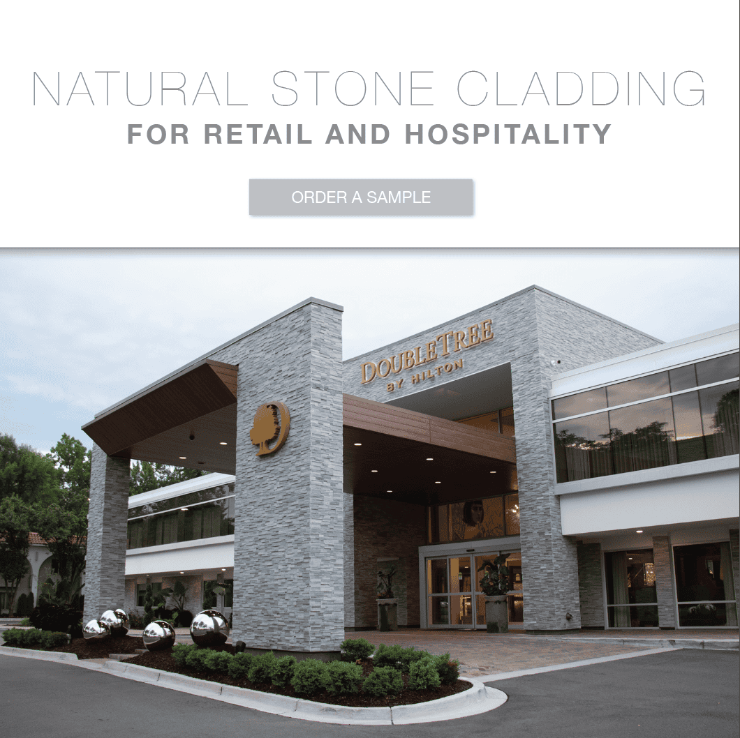 retail storefront with stacked stone facade and panelized stone veneer commercial cladding system